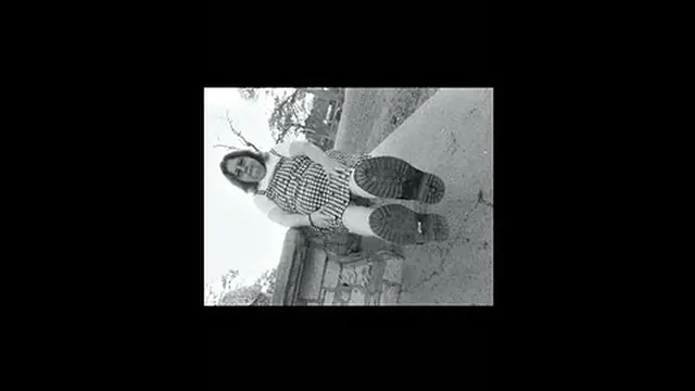 Nurse vicki models in her black and whot hogwarts outfit and spiked boots