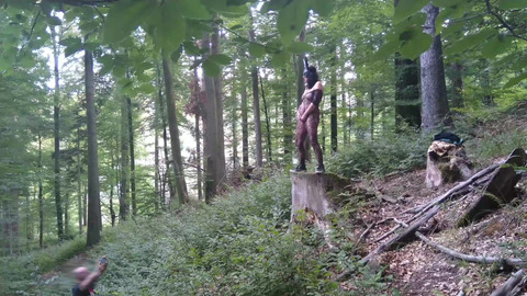 Standing pissing in a woods in a bunny mask and fishnet
