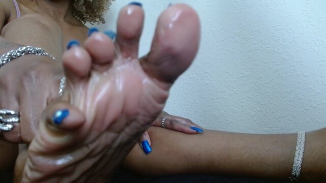 Black Mistress teases and tickles barefoot slave